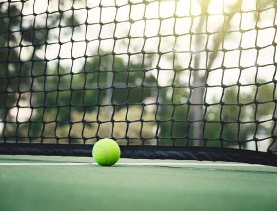 tennis-ball-on-tennis-court